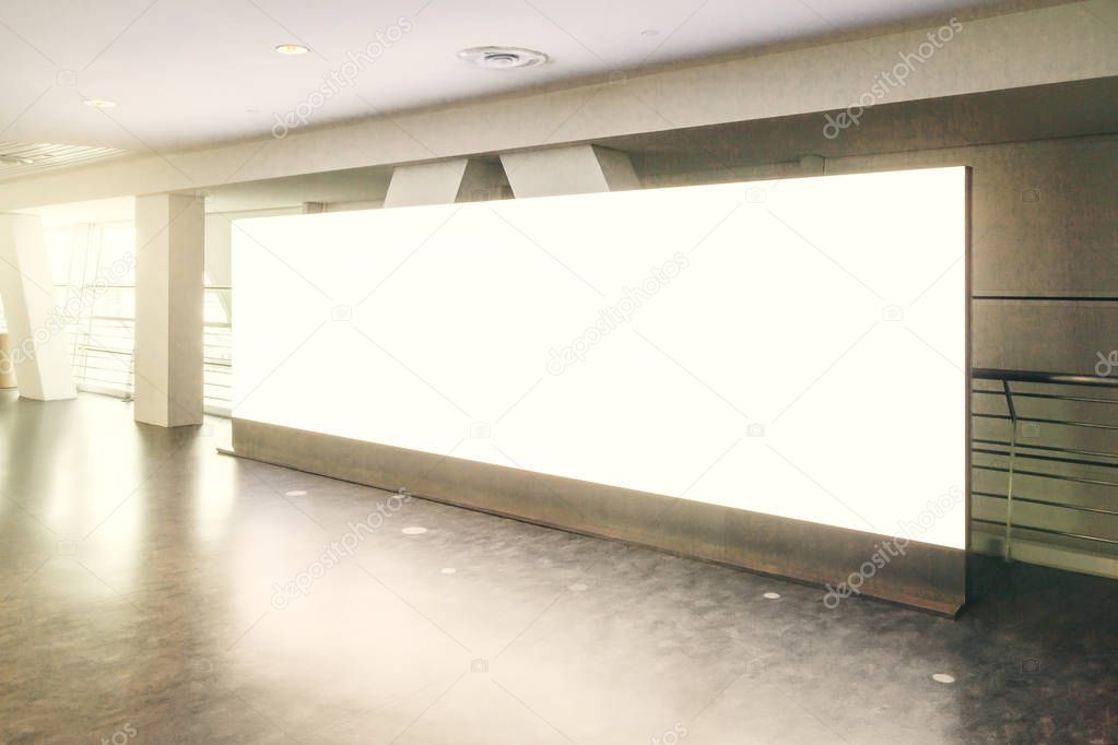 Concrete subway with empty billboard