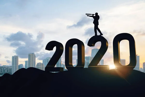 Businessman standing on 2020 new year text — Stock Photo, Image