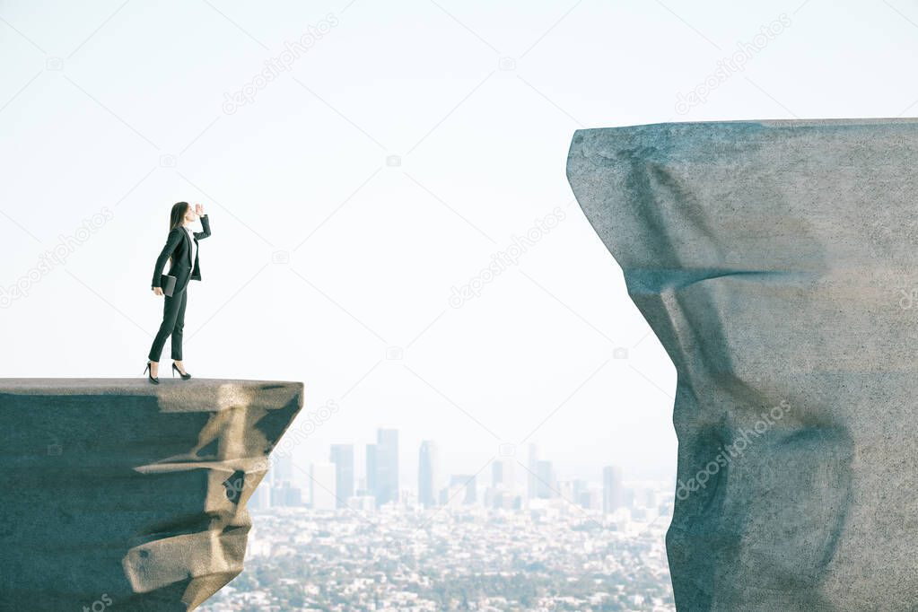 Businesswoman on cliff