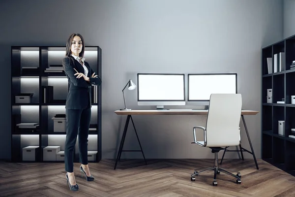 Businesswoman standing in designer room