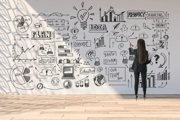 Businesswoman drawing global marketing plan on wall. — 스톡 사진