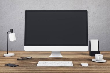Designer desktop with computer on wooden table