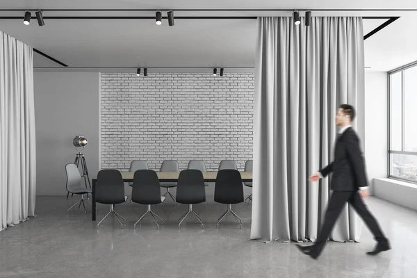 Businessman walking in meeting room interior — 스톡 사진