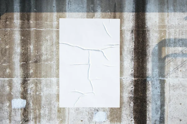Blank white poster on loft style concrete wall — ストック写真