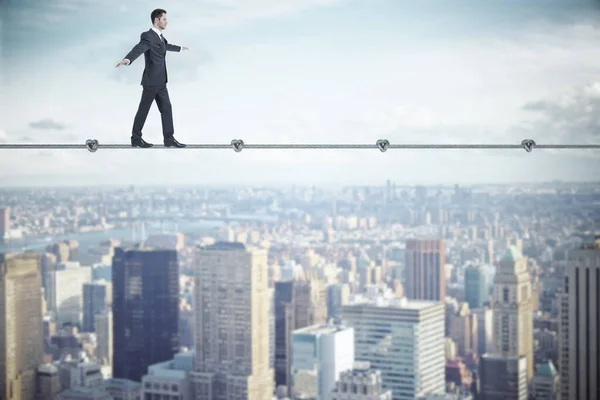 Businessman walking on rope — Stock Photo, Image