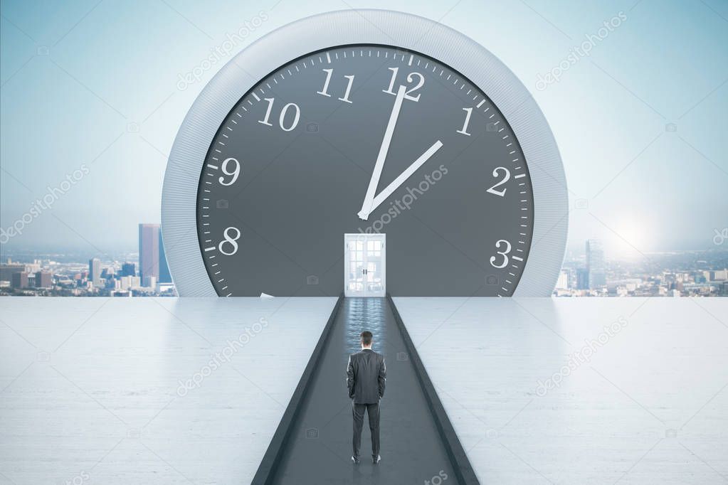 Businessman looking on big clock with door on a city view background. Business and deadline concept.