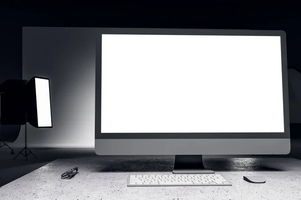 White computer screen in contemporary photo studio with professional lighting equipment. Photgraphy concept. 3D Rendering