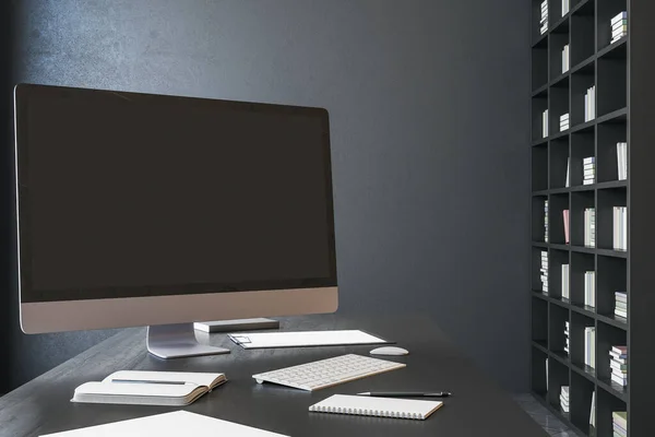 Clean designer desktop with empty black computer screen. Wooden shelf with book and blank wall. Mock up, 3D Rendering