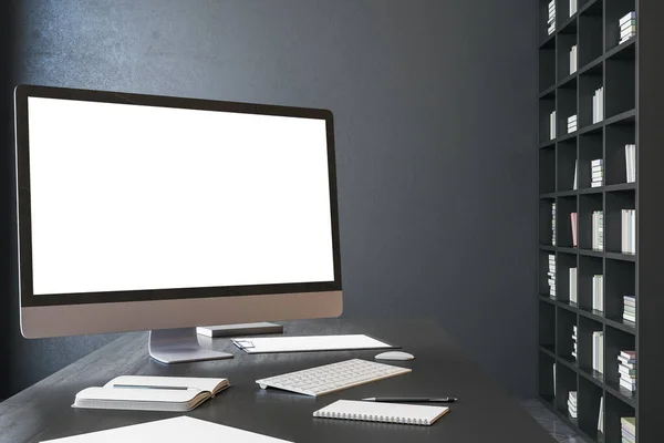 Modern designer desktop with empty white computer screen. Wooden shelf with book and blank black wall. Mock up, 3D Rendering
