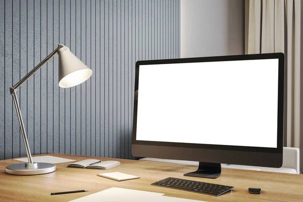 Designer desktop with empty white computer screen and lamp. Business and design concept. Mock up, 3D Rendering