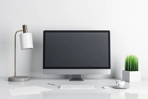Stylish designer desktop with empty computer screen and lamp on table. Mock up, 3D Rendering