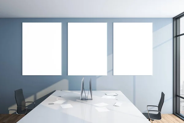 Office room with computer and three blank poster on gray wall.  Workplace and lifestyle concept. 3D Rendering