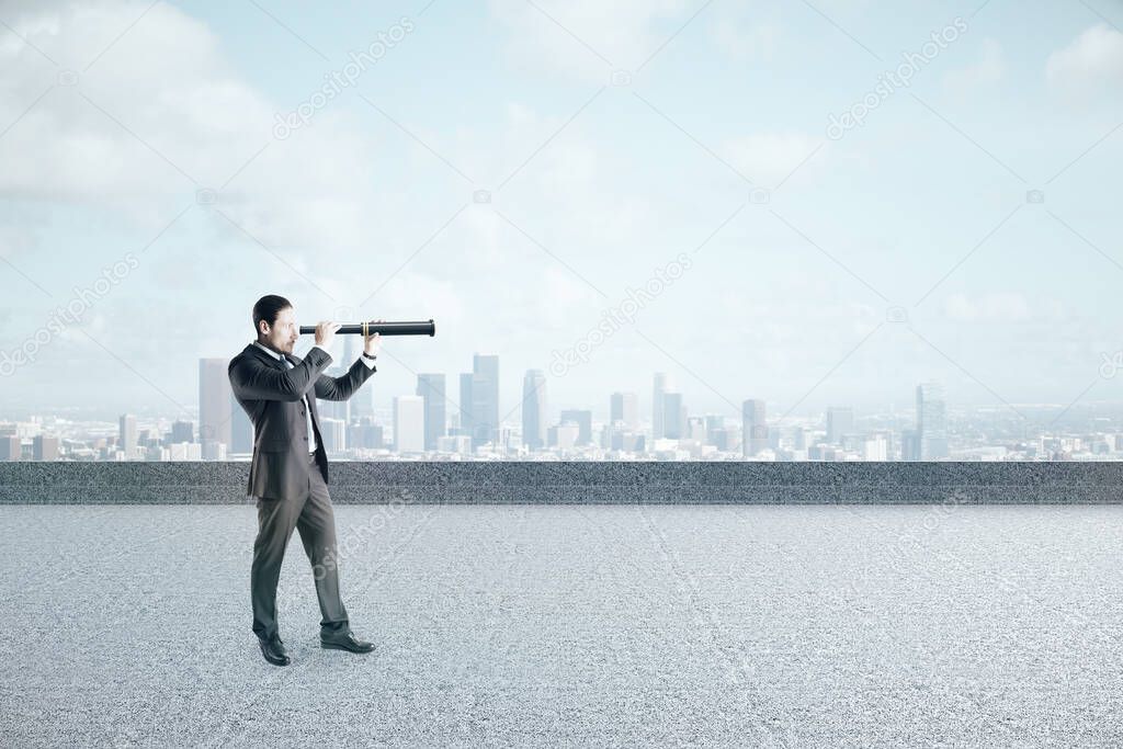 Businessman looking into distance with telescope on sky background with copy space. Vision and challenge concept