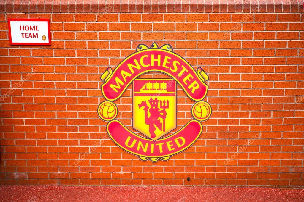 Manchester, England, UK - March 22, 2019 - Wall with symbol of Manchester United FC in the Old Trafford