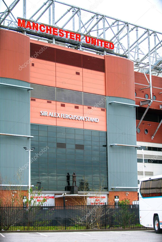 Manchester, England, UK - March 22, 2019 - Front view of The Old Trafford, the home football stadium of Manchester United Team in Premier League, at Sir Alex Ferguson Stand
