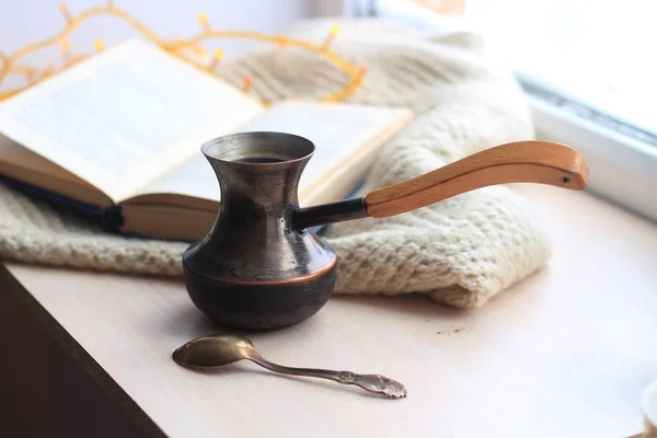 Winter still-life of tea and book