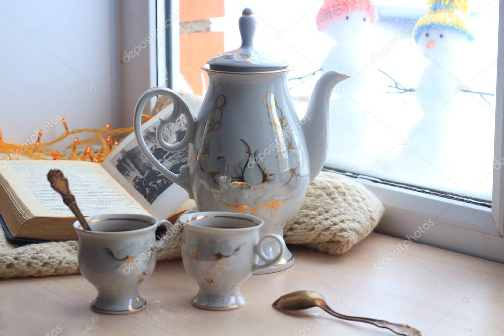 Winter still-life of tea and book