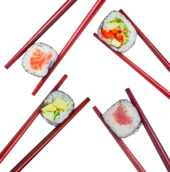 Sushi Set aus roten Stäbchen aus Holz isoliert auf weißem Hintergrund — Stockfoto