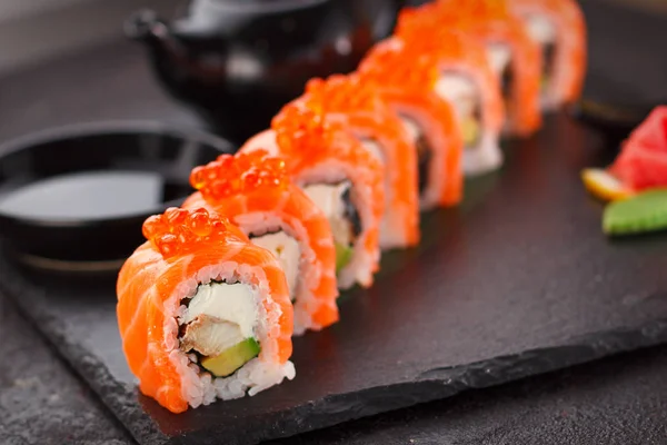 Japanese cuisine.  Sushi roll over concrete background. — Stock Photo, Image