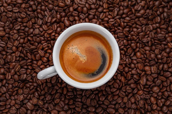 A cup of coffee on a wooden table. — Stock Photo, Image