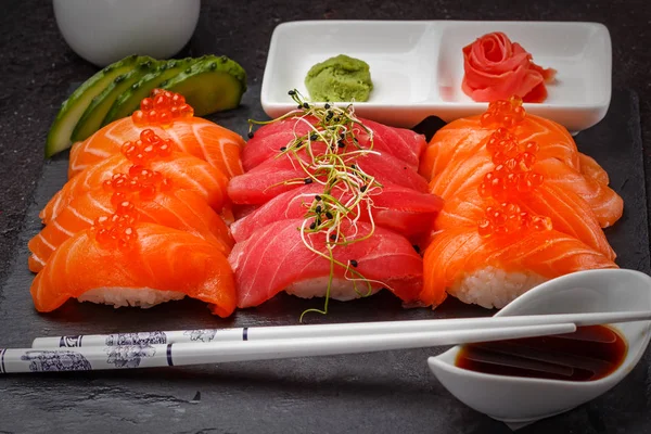 Japanese cuisine. Sushi set over dark background. — Stock Photo, Image