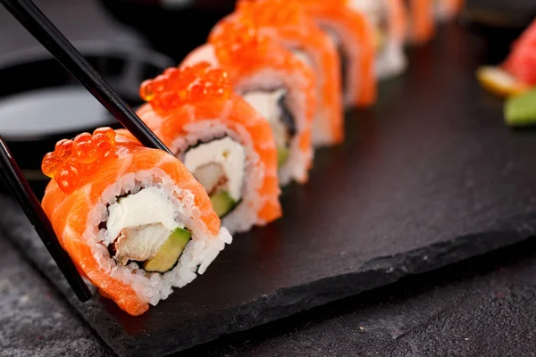 Japanese cuisine. Sushi over dark background. — Stock Photo, Image