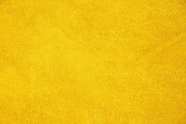 Suede. The texture of the skin is natural. Background of yellow.