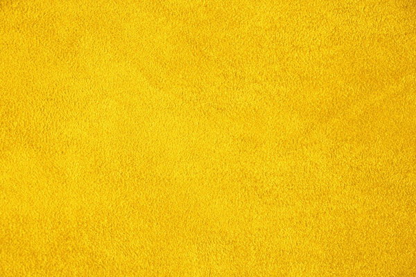 Suede. The texture of the skin is natural. Background of yellow.