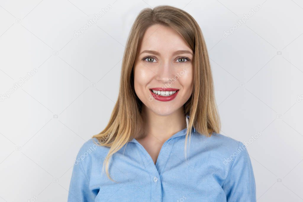 portrait of young blond smiling woman on isolated white background, pure beauty