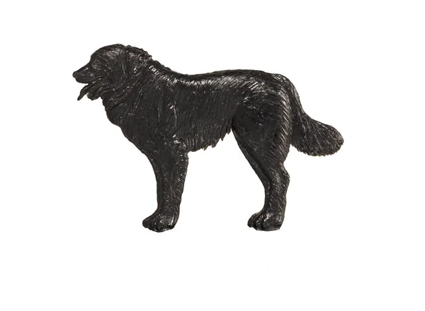 Schwarze Hundefigur auf weißem Hintergrund — Stockfoto