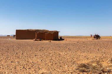 Berber house in the desert Sahara clipart