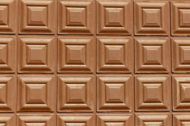 Kahverengi renkteki karelerden soyut arkaplan.