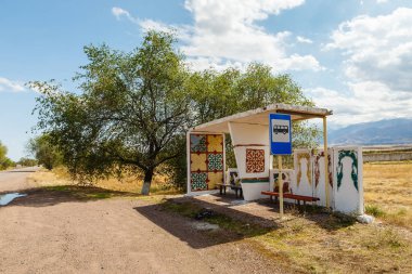bus stop and road stop sign