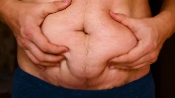 Man showing his fat on the stomach. — Stock Footage Man Showing His Fat Stomach Video Clip