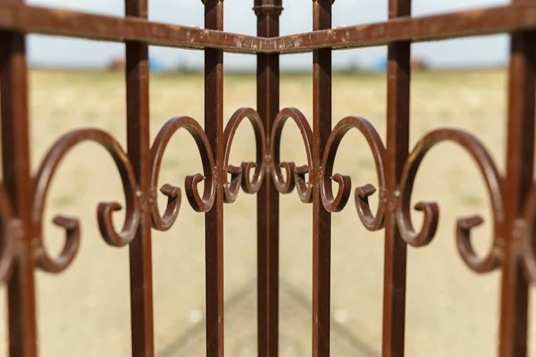 Decorative wrought iron fence. Patterns on the fence.