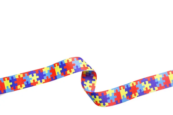 World Autism awareness and pride day with Puzzle pattern ribbon isolated on white — Stock Photo, Image
