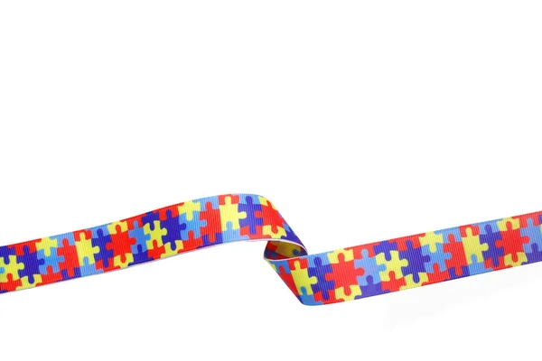 World Autism awareness and pride day with Puzzle pattern ribbon isolated on white — Stock Photo, Image