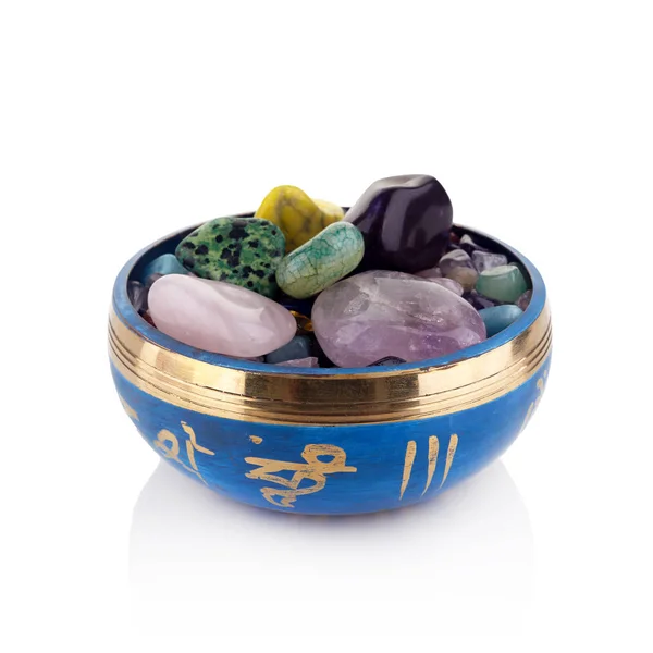 Tibetan singing bowl and multicoloured healing chakra stones isolated on white background — Stock Photo, Image