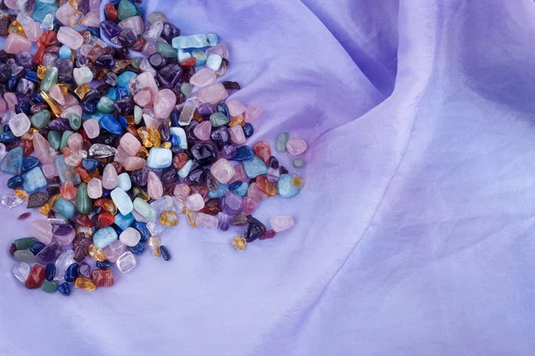 Chakra healing crystals on pastel silk background — Stock Photo, Image
