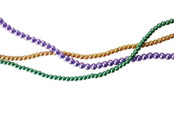 Drei Farben mardi gras Perlen für die Dekoration isoliert ob weißen Hintergrund — Stockfoto