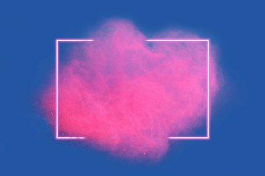 Pink neon powder explosion with gliwing frame on blue background. Colored cloud. Colorful dust explode. Paint Holi. clipart