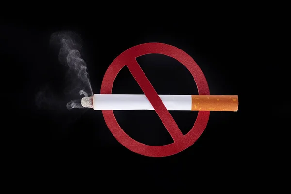 No smoking sign, cigarette isolated on black background.