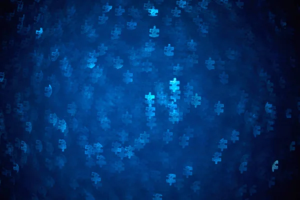 Blue Puzzle forme bokeh. Contexte déconcentré pour la journée de sensibilisation à l'autisme. Une vraie photo. Bleu clair — Photo