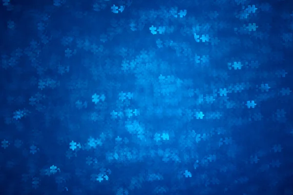 Blue Puzzle forme bokeh. Contexte déconcentré pour la journée de sensibilisation à l'autisme. Une vraie photo. Bleu clair — Photo