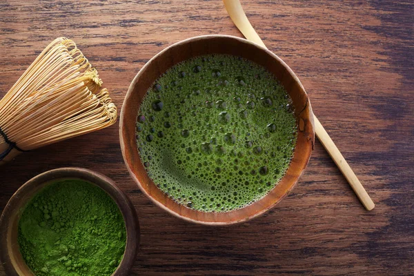Set with green matcha tea on wooden background. Japanese tea ceremony. Food menu background. Tea ceremony set.