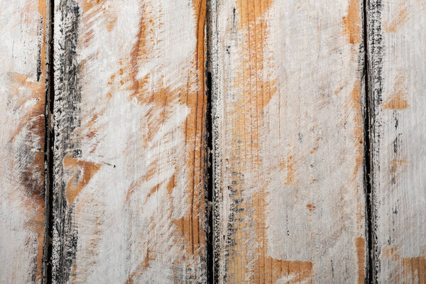 Rustic wood and stone background with varied textures and pastel and dark colors