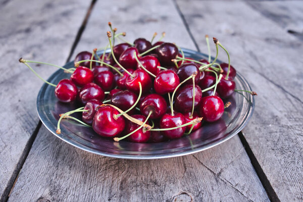 Cherries, red big cherry in the plate