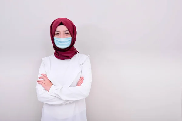 Muslim woman doctor wearing medical mask, muslim girl wearing mask for viral infection