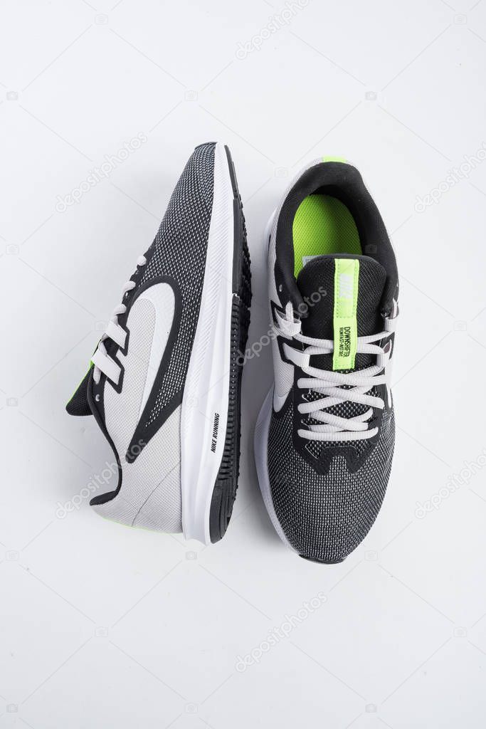 NIKE sports shoes with design for men, black color with non-skid technology on white background