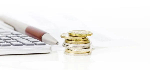 Euro coins and calculator — Stock Photo, Image